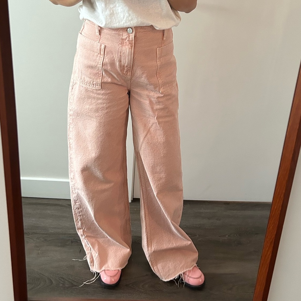 Wide leg high rise jeans in washed light pink
